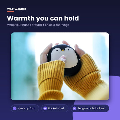 Holding the penguin hand warmer in gloved hands